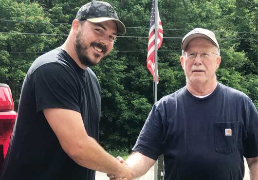 To ensure a smooth transition of ownership of Metal Fence Supply Co., former Owner Paul Gajda (right) has worked with longtime employee and now Owner, Brandon Dando, for the past year to help him learn the ins and outs of running the company.